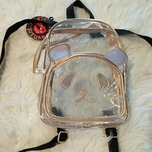 Kiss Me Couture clear panda bag.